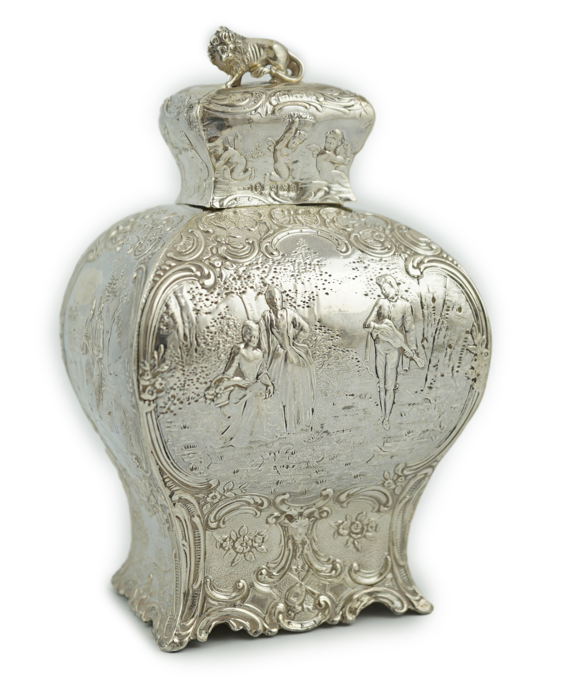 A late 19th century Hanau embossed silver bombé shaped tea caddy and cover